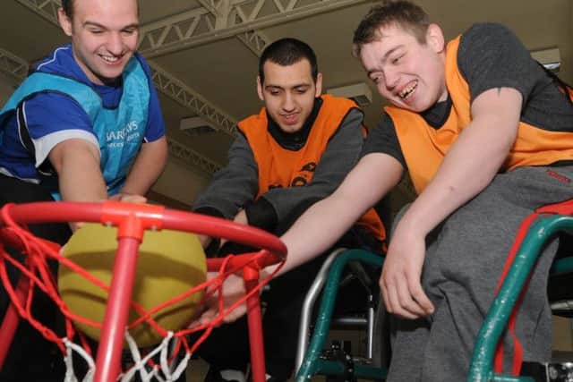 Students and volunteers take part in Wheel chair basket ball at Portland training college today from the left Zac Day ,Josh Martin and Vinny Dooley