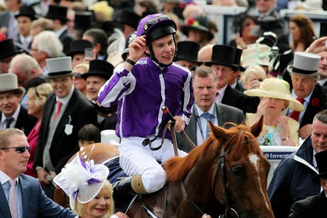 AUSTRALIA'S DAY -- jockey Joseph O'Brien salutes the crowd aboard Australia after winning the Investec Derby at Epsom (PHOTO BY: David Davies/PA Wire).