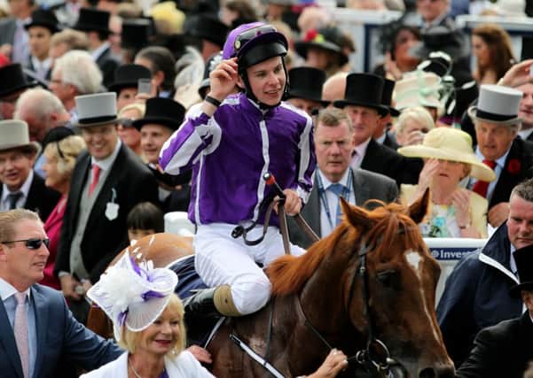 AUSTRALIA'S DAY -- jockey Joseph O'Brien salutes the crowd aboard Australia after winning the Investec Derby at Epsom (PHOTO BY: David Davies/PA Wire).