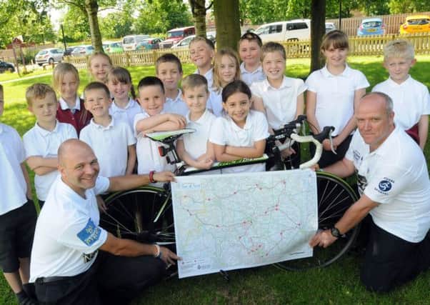 P.C's Rich Naylor, left and Dave Dennis who are joining colleagues for a 165 mile cycle ride in aid of the City Hospital and Bluebell Wood Childrens Hospice and are being backed by pupils from the Leen Mills Schools in Hucknall, who are doing their bit with non-uniform day organised by the School Council.
