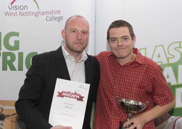 West Notts College governor and managing director of Hall-Fast Industrial Supplies, Malcolm Hall, presents an endeavour award to brickwork student Alex Lane.