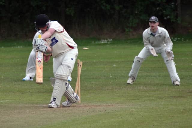 An early breakthrough for Underwood as Anthony Freeman bowls Kirkby opener Luke Gregory.