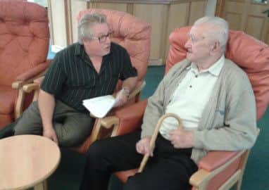 John Snelson, social activities co-ordinator chats to patient Stefan Wozniczka.
