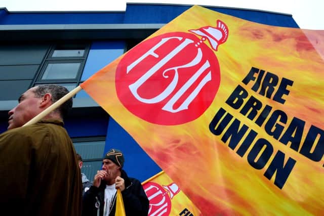 Firemen from Tynemouth Community Fire Station in North Shields on the picket line as firefighters across England and Wales walked out on strike today in a bitter row over pensions, with the threat of further action if the dispute is not resolved. PRESS ASSOCIATION Photo. Picture date: Wednesday September 25, 2013. Members of the Fire Brigades Union (FBU) left their stations and set up picket lines, leaving brigades to put into place contingency plans. See PA story INDUSTRY Fire. Photo credit should read: Owen Humphreys/PA Wire