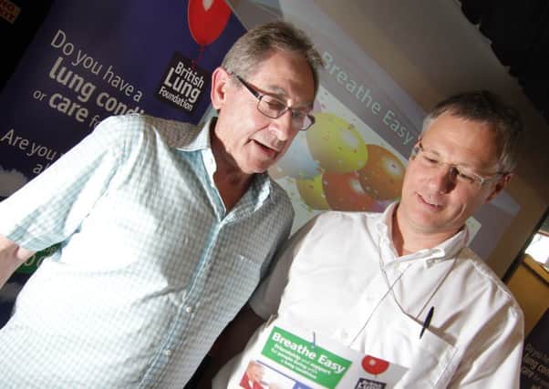 READ ALL ABOUT IT: Phil, left, discusses a BLF Breathe Easy leaflet with Professor Hubbard.