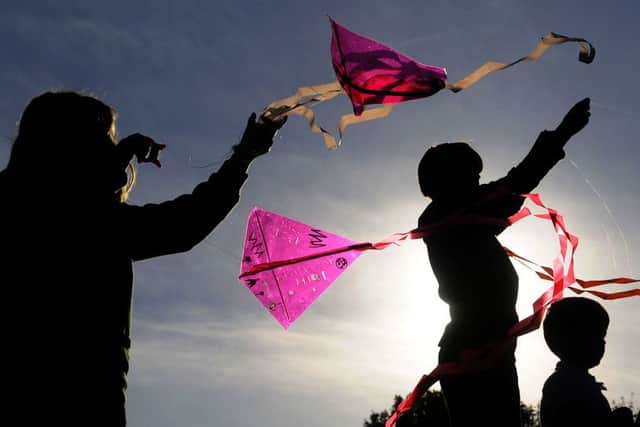 Children from Weeton Primary School make and fly kites with help from parents.