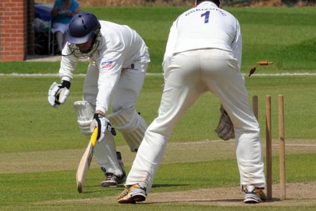Welbeck's Richard Stroh goes to a run out.