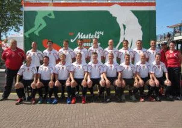 The England masters hockey squad that claimed bronze, with manager Andy Taylor pictured left.
