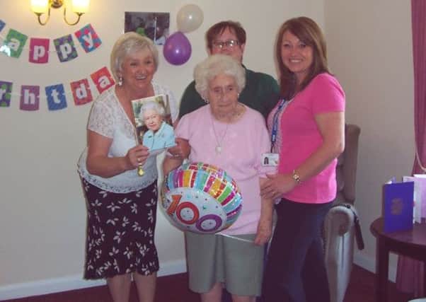 Memorable day: Mary Wharmby on her 100th birthday with step daughter Rosemary and Manor staff.