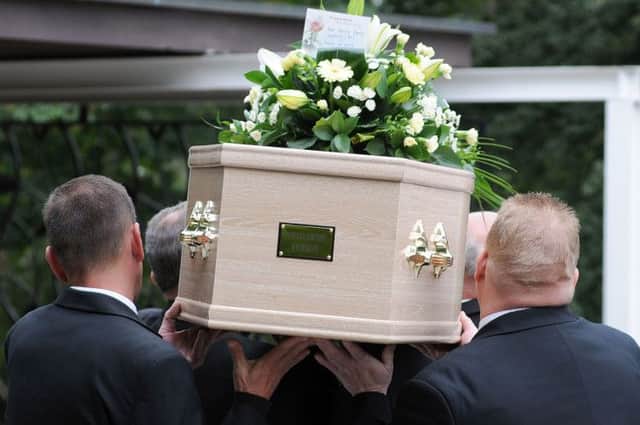 The coffin of Patricia Wycherley is taken into the chapel at the Mansfield Crematorim on Friday.