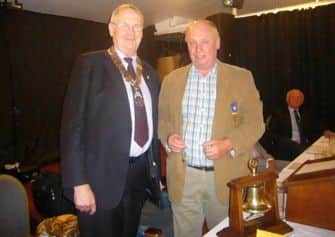 Hand over: President Steve Lunn with past president Roger Wright.