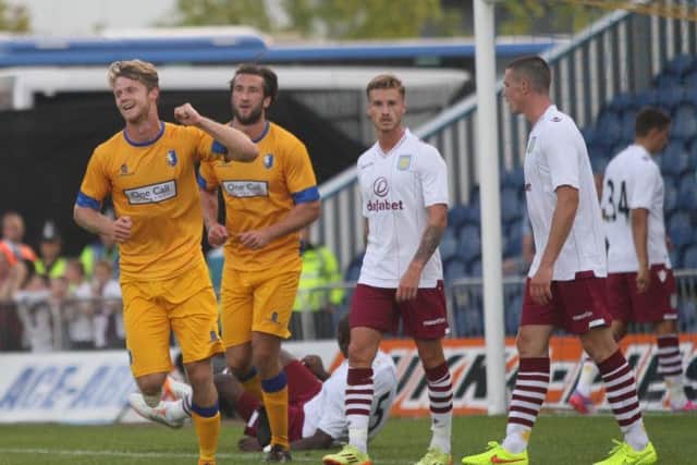 Alex Fisher wheels away after scoring for The Stags-Pic by: Richard Parkes