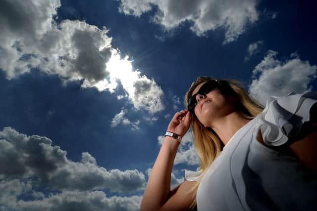 Date: 17th July 2014. Picture James Hardisty. (JH1004/58a) Jenny Garsdale, 19, of Wetherby, enjoying the hot weather in Roundhay Park, Leeds.