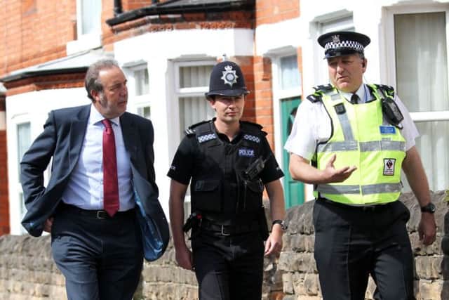 Police and Crime Commissioner Paddy Tipping on a town centre walkabout in Bulwell with Sgt Straszewskyj and Phil Huworth