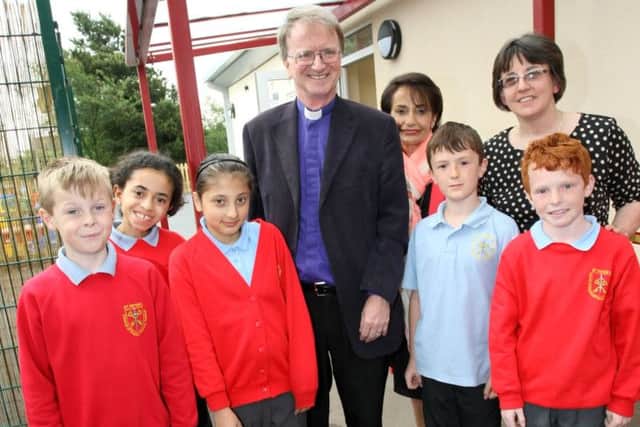 The Bishop of Sherwood Tony Porter opens a new class room block at St Peter's CE Primary School in Mansfield as partbof their 40th celebrations at Bellamy Road. Also pictured are Headteacher Pearl Day and Chair of Goveners Christine Bacon