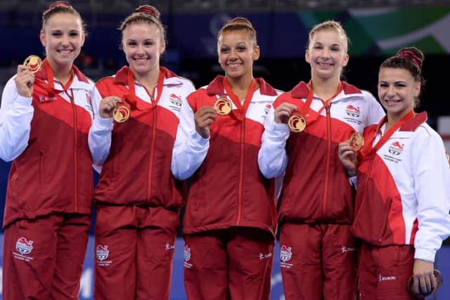 England's (left to right) Hannah Whelan, Ruby Harold, Rebecca Downie, Kelly Simm and Claudia Fragapane celebrate with their gold medals after winning the Women's Artistic Gymnastic's Team Final and Individual Qualificationat the SSE Hydro, during the 2014 Commonwealth Games in Glasgow. PRESS ASSOCIATION Photo. Picture date: Tuesday July 29, 2014. See PA story COMMONWEALTH Athletics. Photo credit should read: Dominic Lipinski/PA Wire. RESTRICTIONS: Editorial use only. No commercial use. No video emulation.