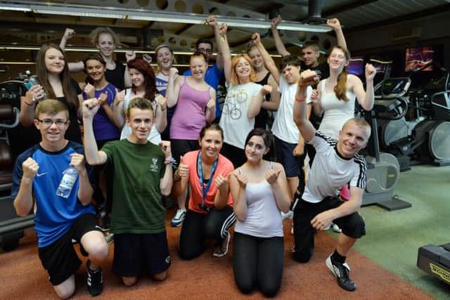 A group of young people taking part in a charity triathlon to raise money for abandonded dogs