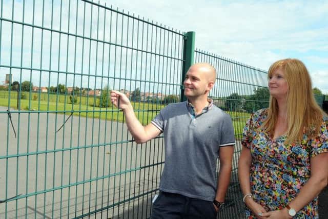 New venue: Flying High Academy headteacher Tony Warsop and his deputy Caroline Marsden inspect the proposed site of the new school buildings , which was partly occupied by the old Ladybrook Primary School.