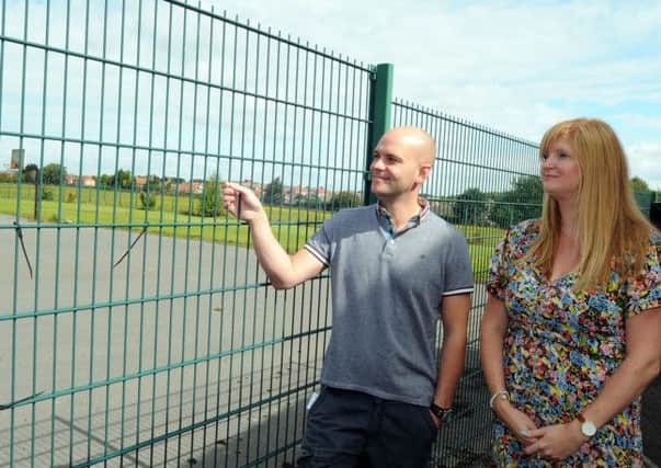 New venue: Flying High Academy headteacher Tony Warsop and his deputy Caroline Marsden inspect the proposed site of the new school buildings , which was partly occupied by the old Ladybrook Primary School.