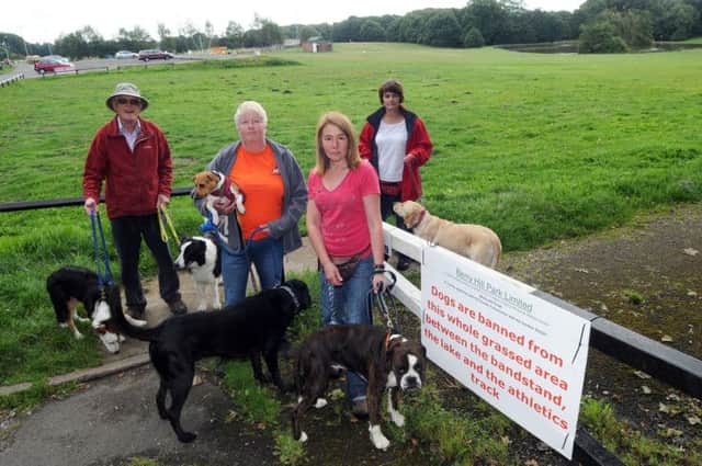 Park users lend their support to dog walker Tracy Dawes, pictured second left with Ted and Buttons, who objects to new rules regarding the walking of dogs on Berry Hill Park, they are from left, Graham Wellings with Jango and Rush, Jane Stewart with Meg and Lucy and Fion Leatherland with Bentley.