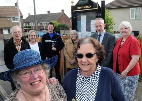 Ladybrook Neighbourhood watch founders, Mary Penford MBE, front left and Iris Goodall, front right, pictured with some of their supporters from left, back row, Bob Reynolds, Elaine Lamb, PCSO Craig Bull, Jean Drabble, Colin Handley, representing the Crime Commissioner's office, and coun Sally Higgins.