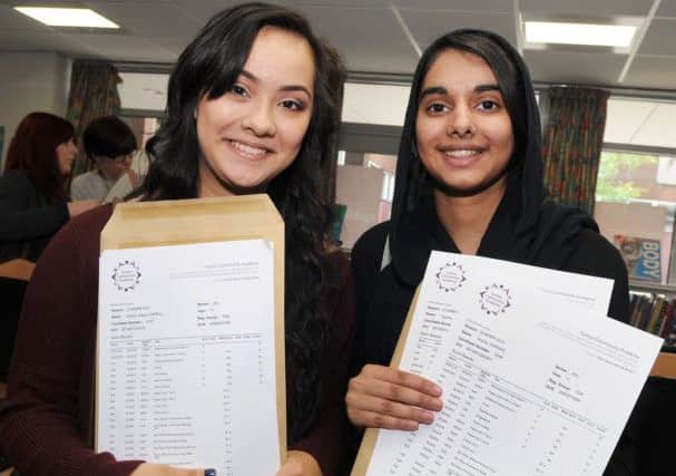 Sophie Carroll, left, and Sophia Parvaiz with their G.C.S.E results after picking them up from the Sutton Community Academy last Thursday.