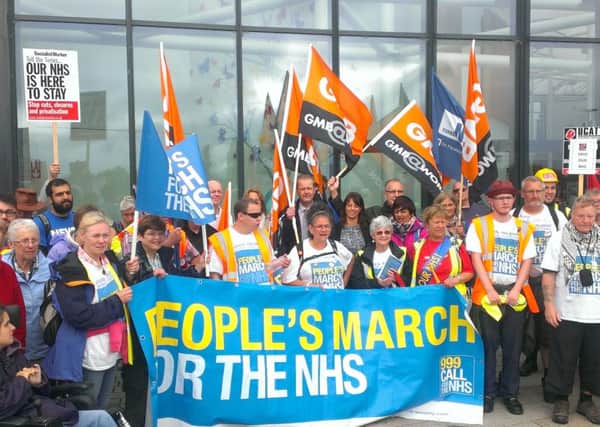 Protestors on the People's March to Save the NHS assemble at King's Mill Hospital.