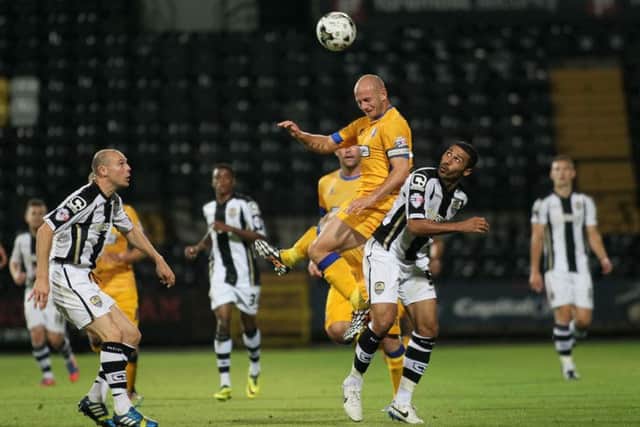 Adam Murray climbs highest for the Stags at Meadow Lane - Picture by Richard Parkes