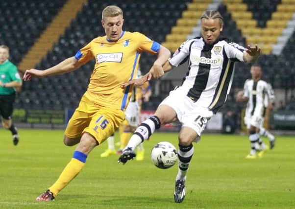 Simon Heslop chases down Notts County's Curtis Thompson -Pic by: Richard Parkes