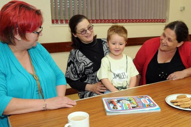 Pictured at a Supporting Parents in Crisis meeting at the Healdswood Community Centre on Friday evening are from left, Margaret Renshaw the group's treasurer, service user, Georgina Robertson and her son Alistair and Sheila Riley the group chairman.