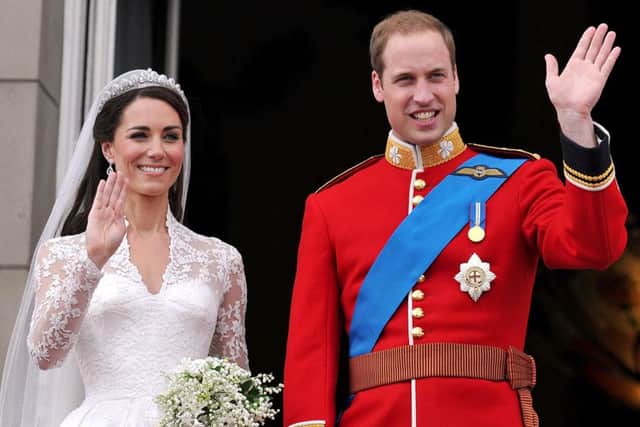 Prince William and his wife Kate Middleton, who has been given the title of The Duchess of Cambridge, wave to the crowd from the balcony of Buckingham Palace, London, following their wedding at Westminster Abbey.