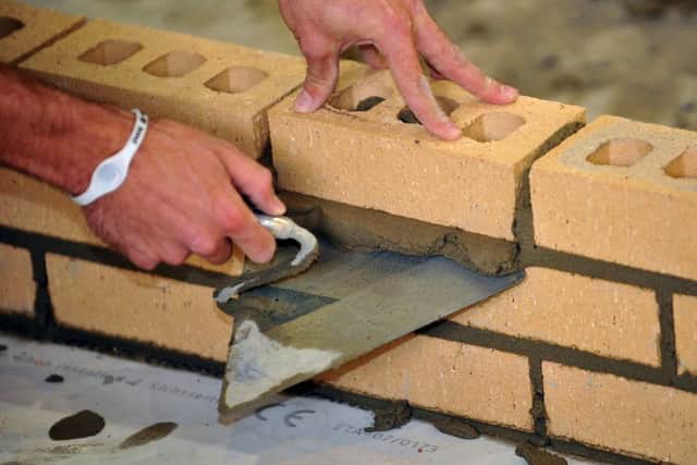 File photo dated 06/10/11 of a trainee bricklayer as teenagers are to be offered new courses in engineering and construction as part of an overhaul of vocational education, ministers announced. PRESS ASSOCIATION Photo. Issue date: Thursday March 7, 2013. The Government said it is developing seven new qualifications in the two subjects, which it says will give students the skills and knowledge employers need and prepare them for careers in these industries. It also confirmed that thousands of vocational qualifications could be cut from A-level league tables as part of a fresh bid to raise standards. In total, there will be four new vocational qualifications in engineering and three in construction. The move is likely to draw comparisons with the last Labour government's flagship diploma qualifications. See PA story EDUCATION Qualifications. Photo credit should read: Ian Nicholson/PA Wire