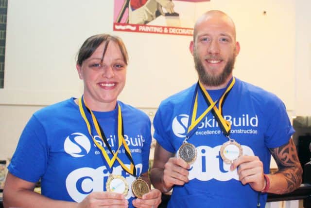 West Notts College students Anna Lodge and Frankie Hawson show off their gold and silver medals from the regional SkillBuild competitions.
