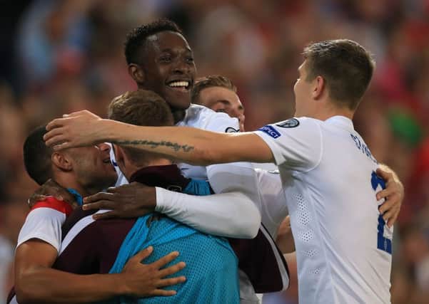 England's Danny Welbeck celebrates scoring his side's first goal of the game against Switzerland.