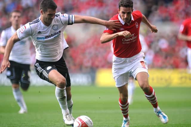 Nottingham Forest's Matt Derbyshire (right) and Derby County's Jason Shackell in action during the npower Football League Championship match at the City Ground.