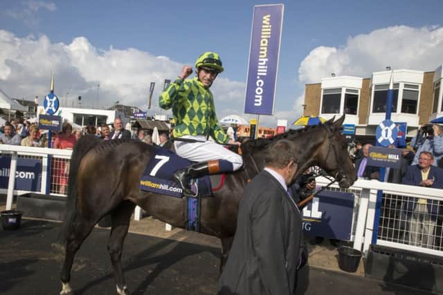 JOCKEY James Doyle celebrates after his mount, Louis The Pious, had won the big race on Saturday, the William Hill Ayr Gold Cup. (PHOTO BY: Jeff Holmes/PA Wire).
