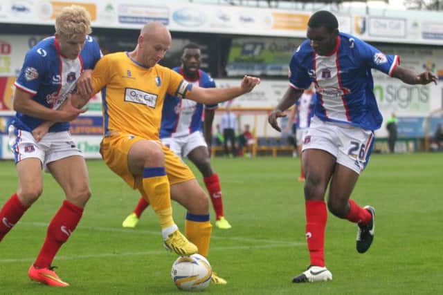 Adam Murray finds no way through the Carlisle defence -Pic by: Richard Parkes