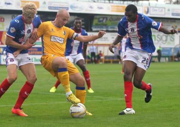 Adam Murray finds no way through the Carlisle defence -Pic by: Richard Parkes