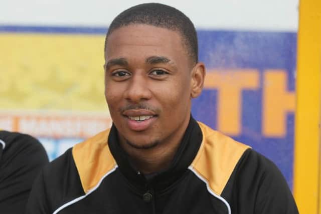 Mansfield's new signing, Reggie Lambe on the subs bench -Pic by: Richard Parkes