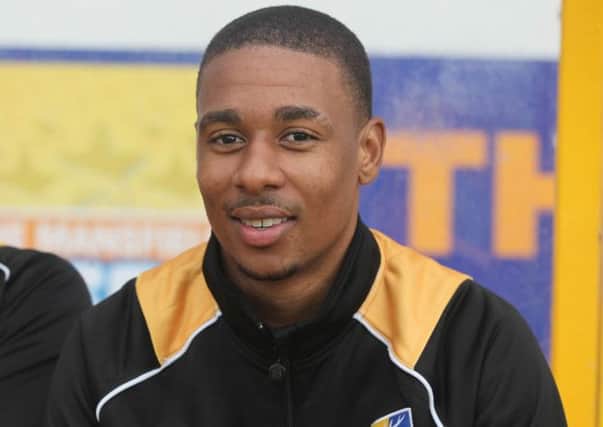 Mansfield's new signing, Reggie Lambe on the subs bench -Pic by: Richard Parkes