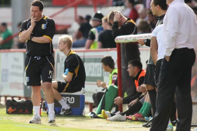 Mansfield manager Paul Cox ponders his next move as Stevenage score there second goal -Pic by: Richard Parkes