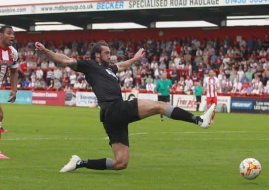Ollie Palmer fails to get a touch on Tafazolli's long pass -Pic by: Richard Parkes