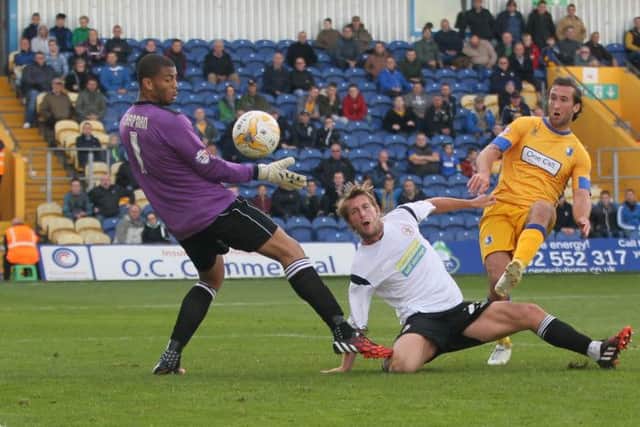 Ollie Palmer is foiled by Accrington defender Rob Atkinson -Pic by: Richard Parkes