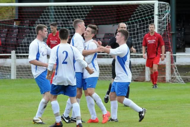 Blidworth Welfare (white and blue) v Clipstone in FA Vase action.  Blidworth celebrate their first half goal.