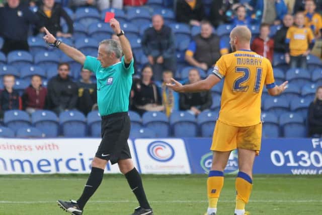 Referee Scott Mathieson sends off Mansfield skipper Adam Murray -Pic by: Richard Parkes
