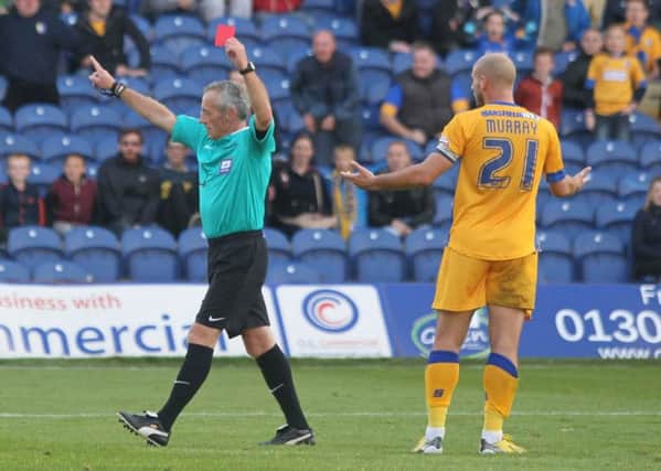 Referee Scott Mathieson sends off Mansfield skipper Adam Murray -Pic by: Richard Parkes