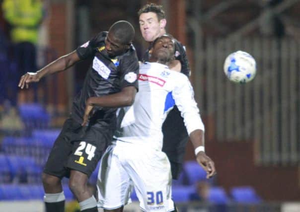 Daniel Carr and Lee Beevers combine to stop Tranmere's Armand Gnanduillet -Pic by: Richard Parkes