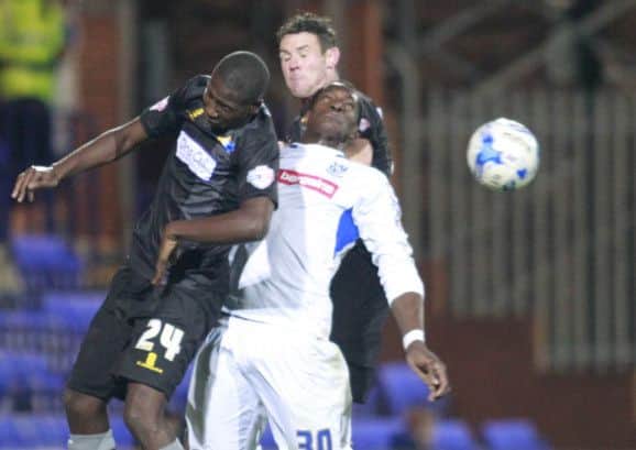 Darren Carr and Lee Beevers combine to stop Tranmere's Armand Gnanduillet -Pic by: Richard Parkes