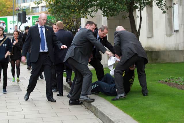 Picture shows a man being arrested after Prime Minister David Cameron left Leeds Civic Hall after a conference on the planned HS2 rail links. See Ross Parry copy RPYCAMERON
rossparry.co.uk / Steven Schofield
