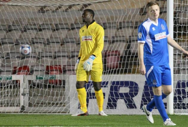 Anthony Howell can only look on as Lincoln score there opening goal -Pic by: Richard Parkes